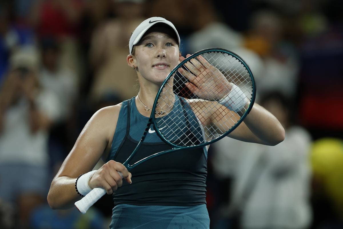 Mirra Andreeva applauds fans after the victory against Marie Bouzkova of the Czech Republic in their Women’s Singles First Round match during day one of the 2025 Australian Open at Melbourne Park on January 12, 2025 in Melbourne, Australia.