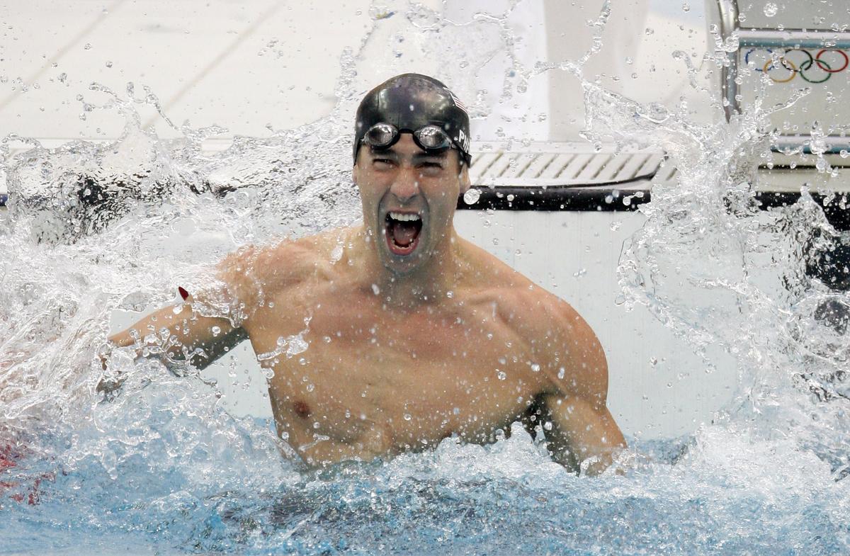 Michael Phelps celebrates after winning the men’s 100m butterfly swimming final at the National Aquatics Centre during the Beijing 2008 Olympic Games.