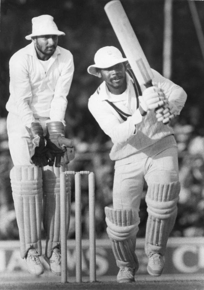 [FILE] Gordon Greenidge, West Indies opening batsman drives 
Ravi Shastri (not in picture) of Indian bowler being watched by Syed Kirmani, scored 96 runs during the third one day international (ODI) cricket match between India and West Indies at Indore on December 01, 1983.
(Published in The Sportstar on December 31, 1983)