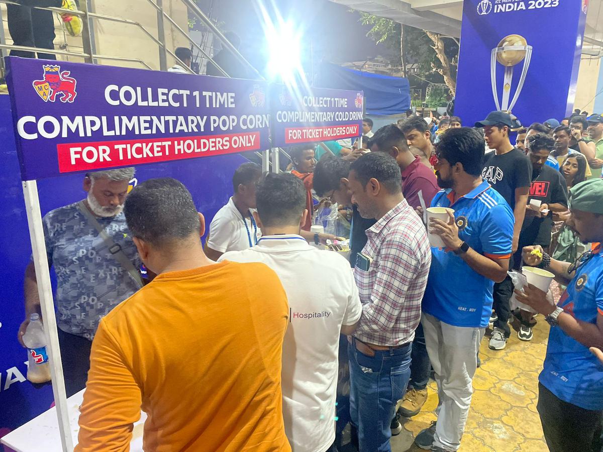 Fans stand in a queue for free refreshments during the India vs Sri Lanka ICC World Cup match at the Wankhede Stadium in Mumbai on Thursday.