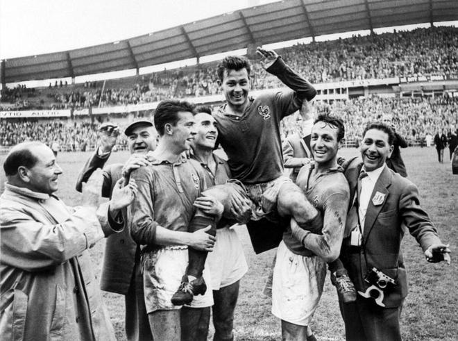 French forward Just Fontaine (C) celebrates and is lifted by teammates Yvon Douis, Andre Lerond and Jean Vincent, after he scored four goals against Germany during a third-place match of the 1958 Swedish World Cup, in Goteborg on June 28, 1958.