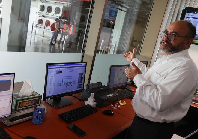 Saud Abdulaziz Abdul Ghani gives a tour of the cooling system at the al-Janoub Stadium in Doha.