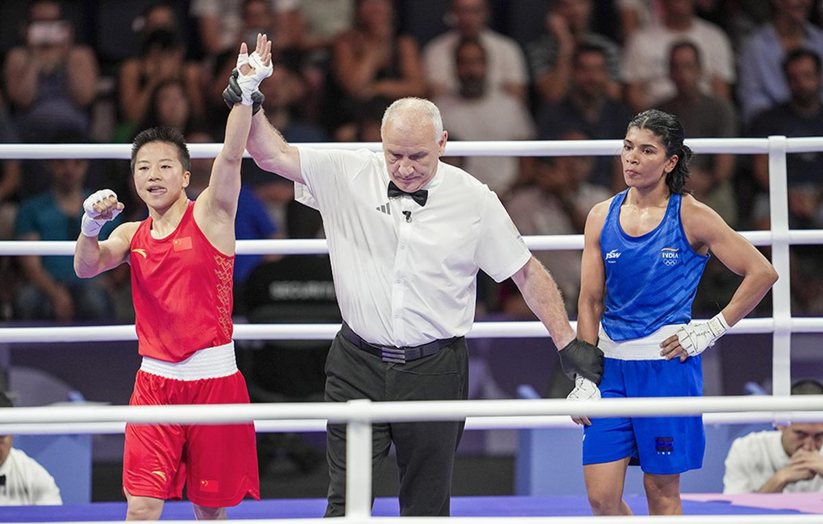 Paris: China’s Wu Yu (in red) being declared winner in the women’s 50kg Round of 16 boxing match against India’s Nikhat Zareen. 