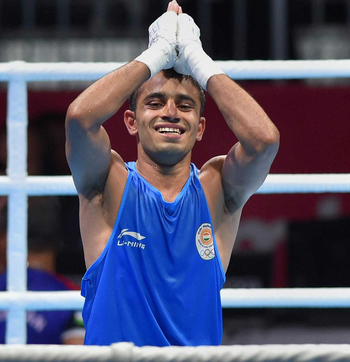 India’s Amit Panghal gestures after winning against Uzbekistan’s Hasanboy Dusmatov during the Men’s light fly (46-49kg) boxing final bout at the 18th Asian Games.