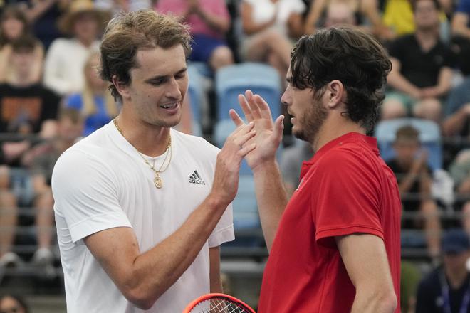 Taylor Fritz (R) is congratulated by Alexander Zverev following their Group C match.