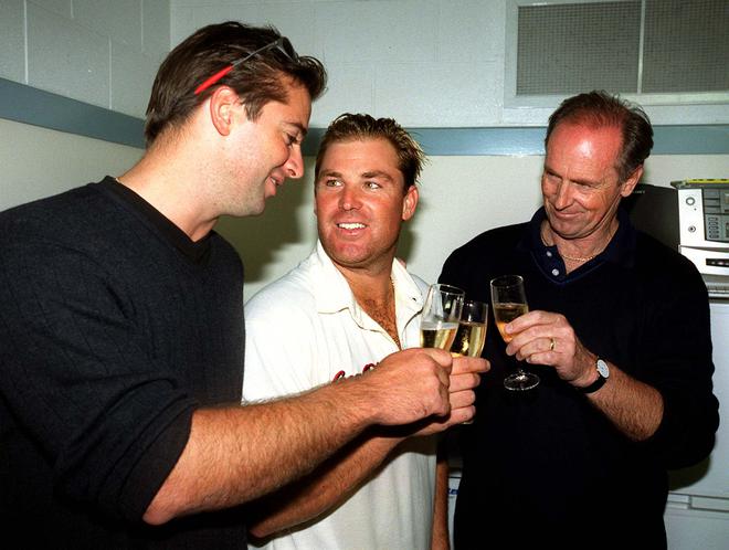Shane Warne shares a toast with his brother Jason (left) and father Keith (R) after taking the Australian record for the most test wickets of 356 at Eden Park on the final day of the National Bank test between New Zealand and Australia. Australia won the match by 63 runs.