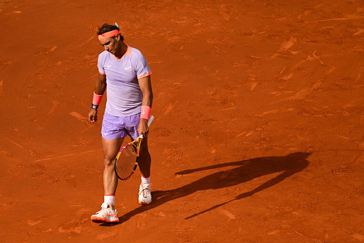 Spain’s Rafael Nadal reacts after missing a point against Australia’s Alex de Minaur during their second-round match at Barcelona Open on April 17, 2024.