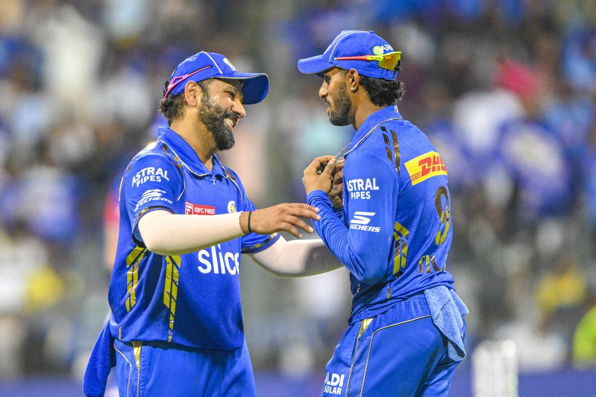 Guided growth: Rohit Sharma’s quiet counsel, Tilak Varma’s eager ear — a passing of wisdom that mirrors Indian cricket’s changing guard.