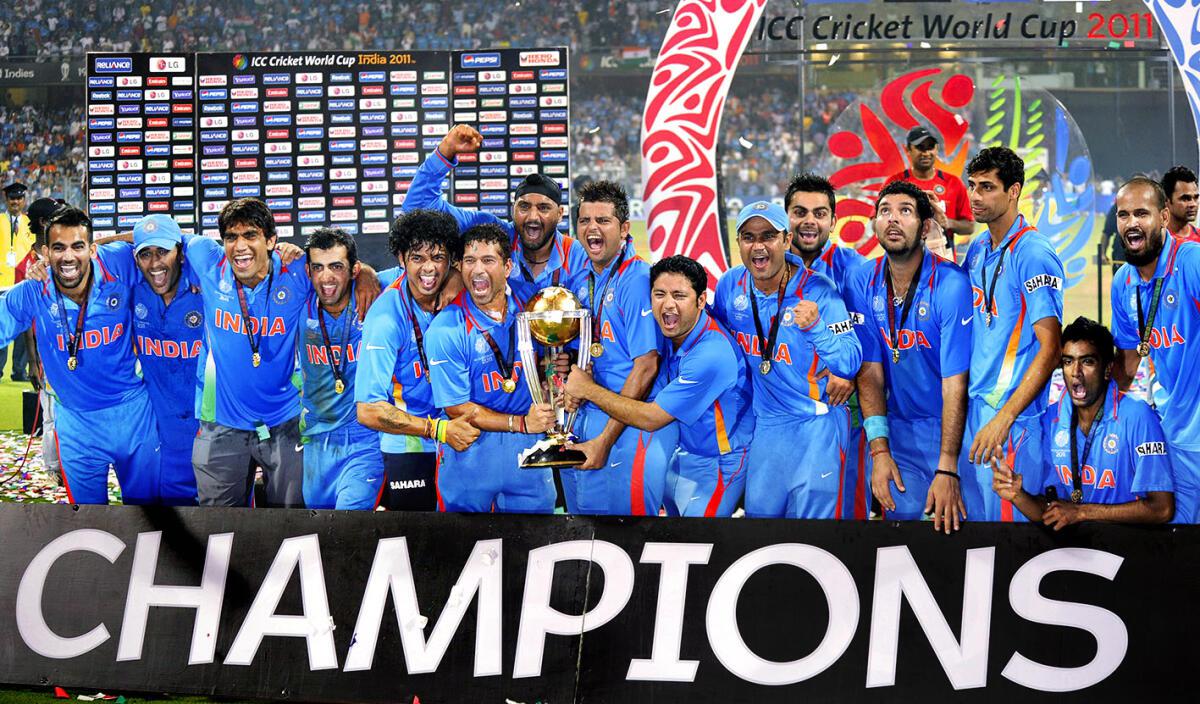 The Indian team poses with the trophy after its victory over Sri Lanka in the final of the ICC Cricket World Cup 2011 at the Wankhede Stadium in Mumbai.