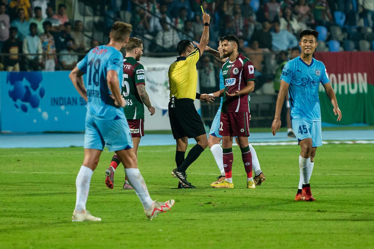 Deepak Tangri of Mohun Bagan Super Giants receives a yellow card against Mumbai City FC at the Mumbai Football Arena in Mumbai.