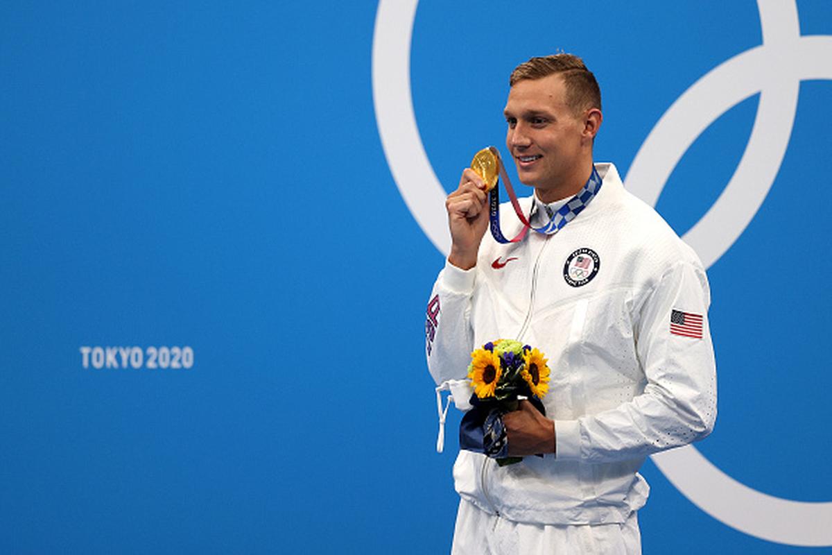 USA’s Caeleb Dressel, gold medallist, poses after the Men’s 100m Butterfly Final at the Olympic Games on July 31, 2021 in Tokyo, Japan.