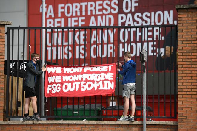 Supporters protest against Liverpool’s US owner John W. Henry and the Fenway Sports Group (FSG) outside Anfield stadium on April 24, 2021, ahead of the game against Newcastle.