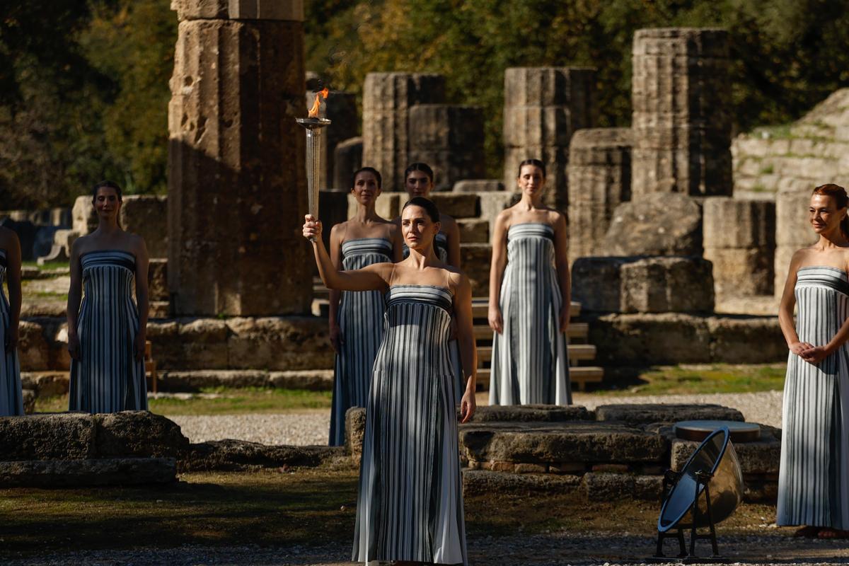 Dancers in the role of priestesses perform during a rehearsal before the lighting of the flame for the 2026 Winter Olympics in Milan-Cortina on the site of ancient Olympia in Greece. 