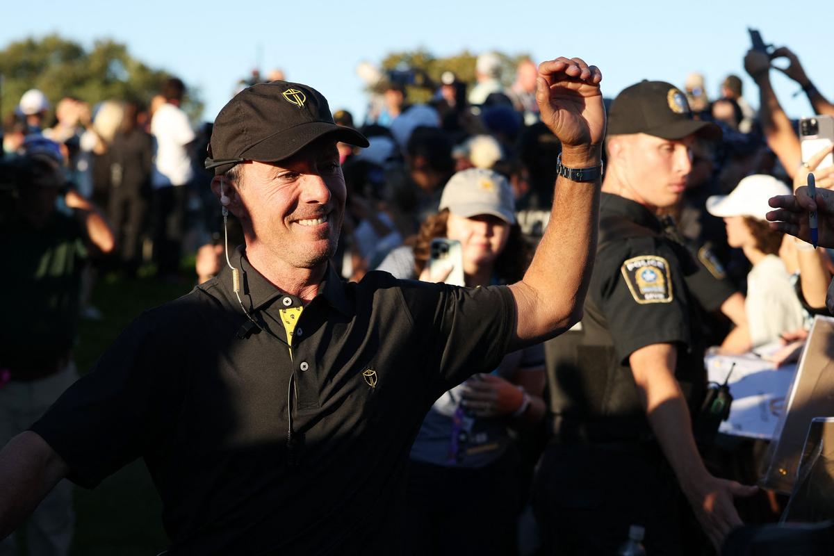 International Team Captain Mike Weir celebrates while walking off the 18th green during Friday Foursomes on day two of the 2024 Presidents Cup.