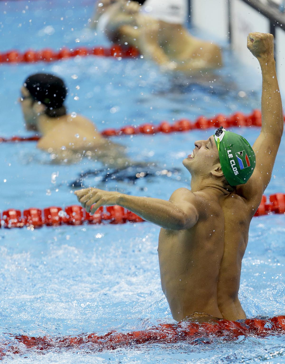 South Africa’s Chad le Clos celebrates his gold medal win in the men’s 200m butterfly swimming final at the 2012 Summer Olympics.