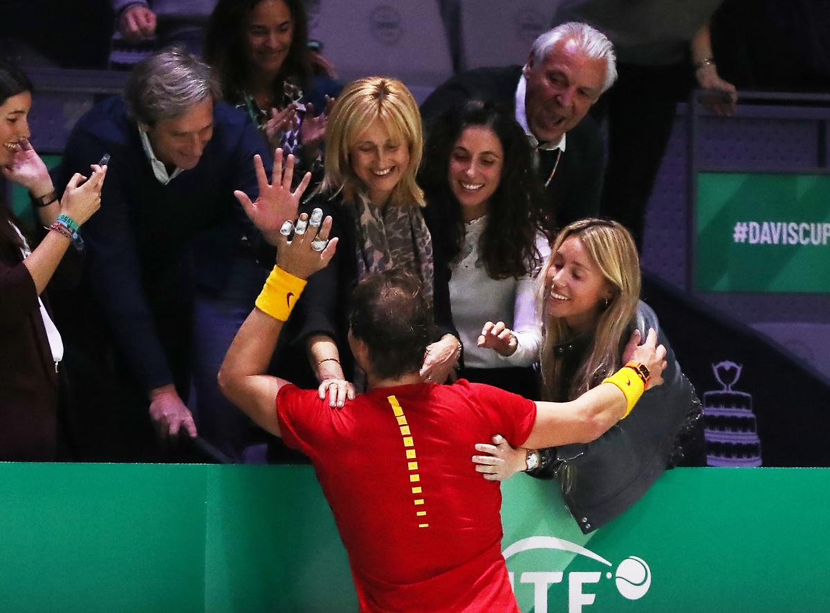 La familia: Nadal celebrates his 2019 Davis Cup triumph with his mother, wife, and sister (left-right), along with his father (top right).