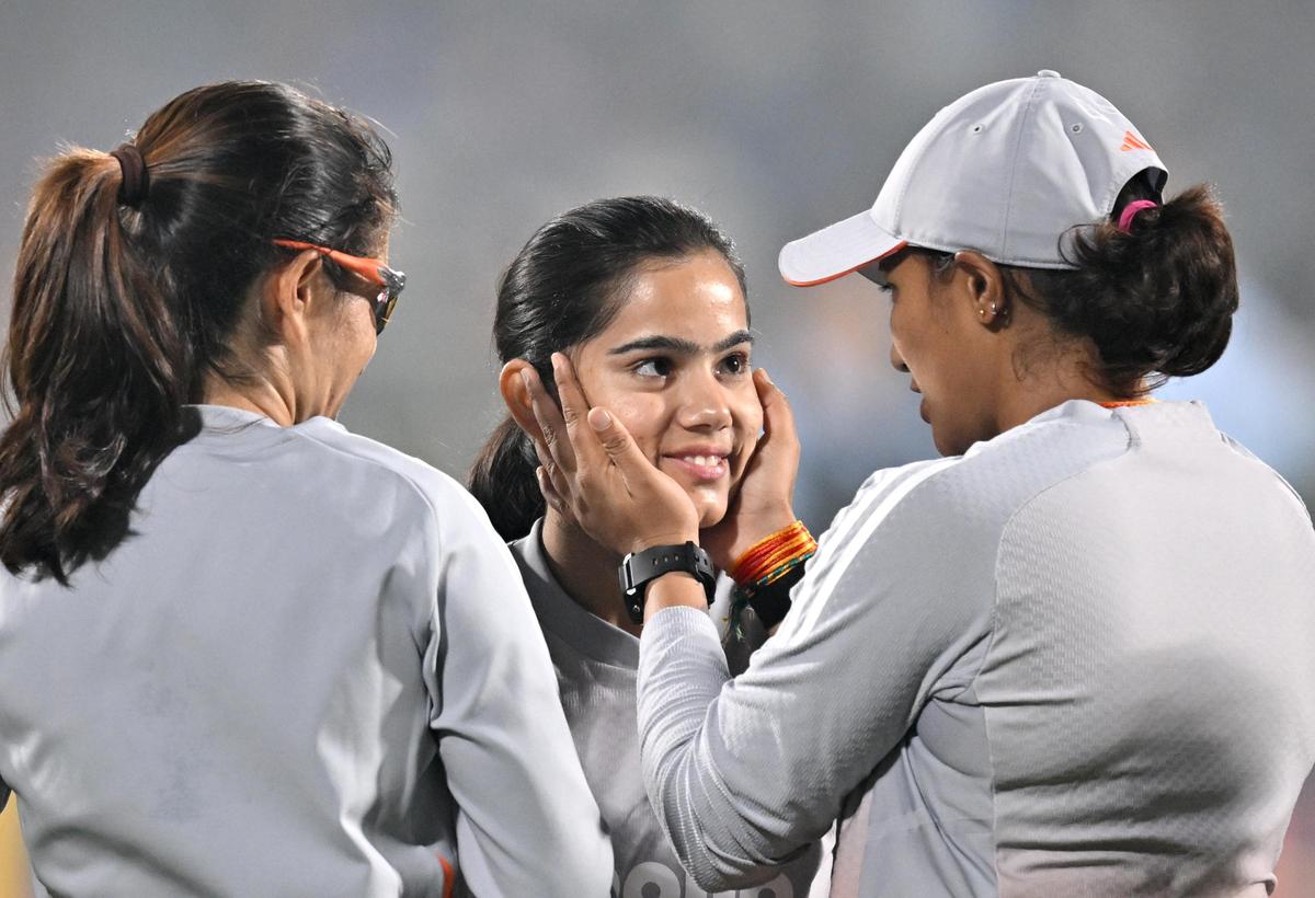 India's Vaishnavi Sharma being congratulated by her teammates after the former received her India cap.