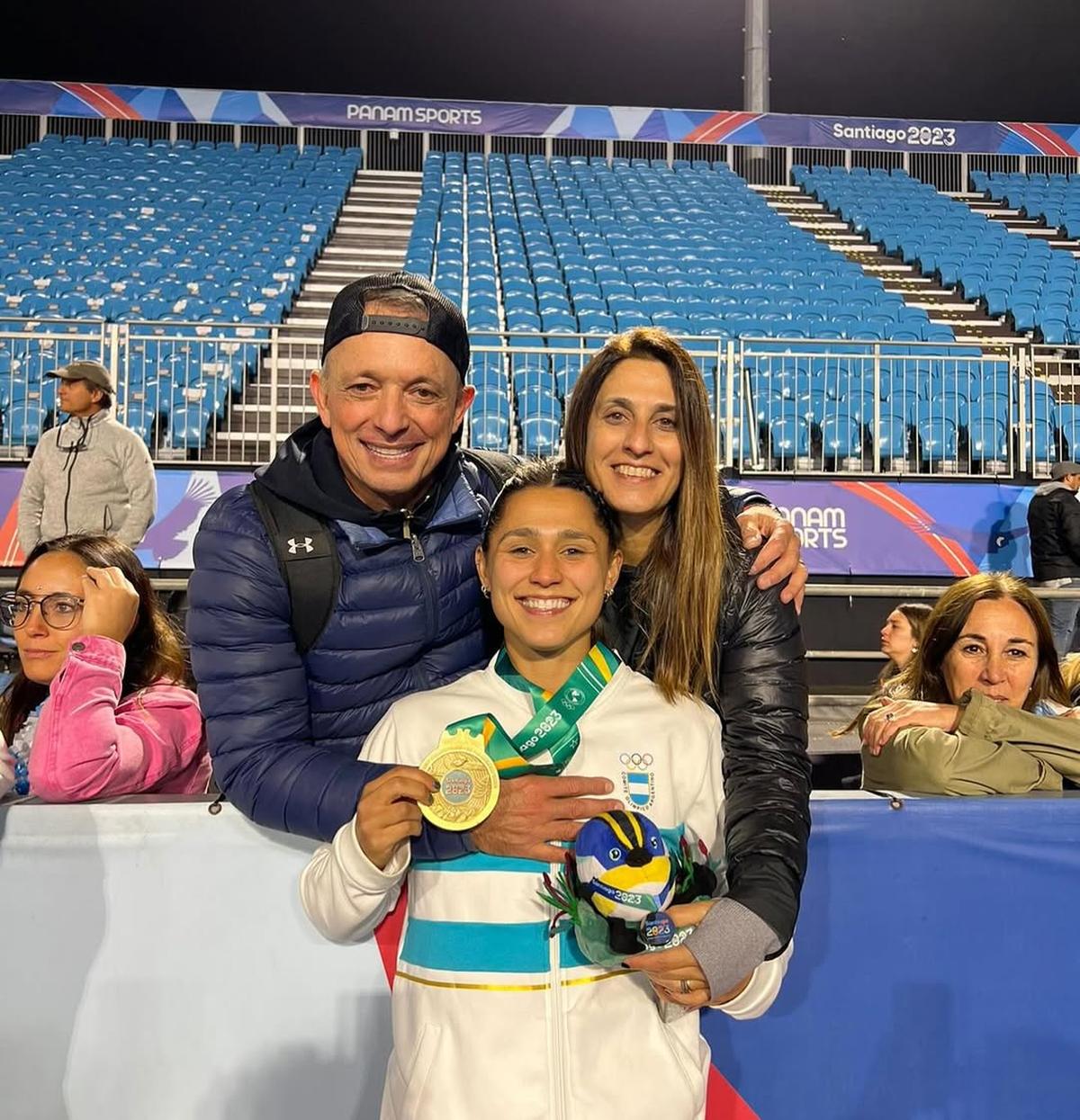 Agustina with her parents, Alejandro and Debora.  