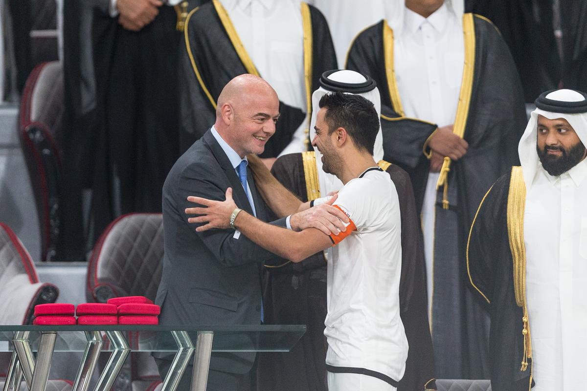 Gianni Infantino, FIFA Prsident, congratulates Xavi, captain of Al Sadd on winning the 2017 Emir Cup at Khalifa International Stadium on May 19, 2017.