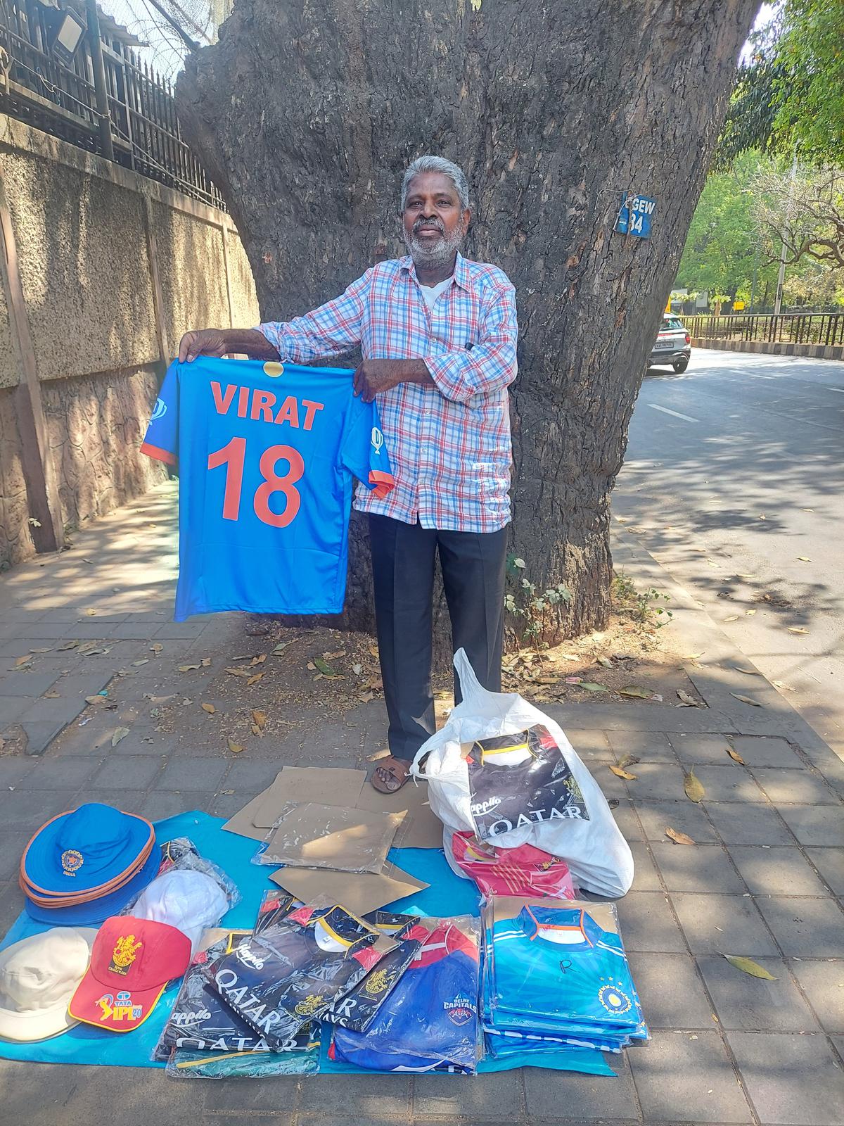 Mallahai, a local jersey vendor near M. Chinnaswamy Stadium in Bengaluru.