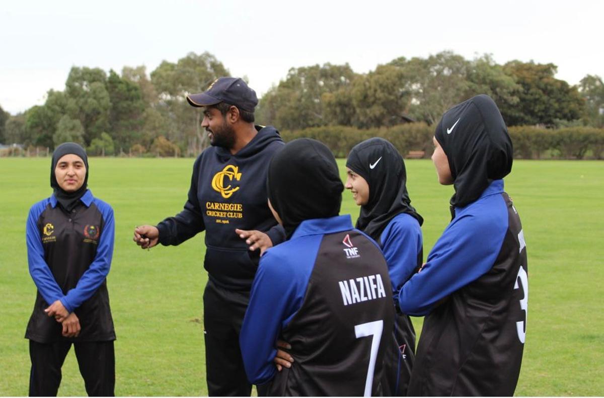 Arvind Suresh with the Afghanistan women cricketers.