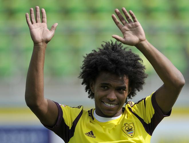 Willian of FC Anzhi Makhachkala acknowledges fans before the start of the Russian Premier League match between FC Anzhi Makhachkala and FC Alania Vladikavkaz at the Anzhi Arena Stadium.