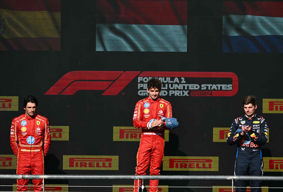 Charles Leclerc (centre) with Carlos Sainz (left) and Max Verstappen (right) on the podium.