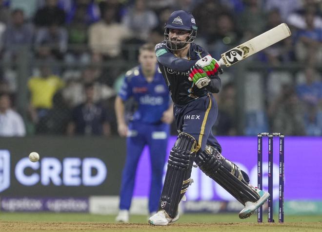 Rashid Khan plays a reverse sweep against Mumbai Indians at the Wankhede Stadium on Friday.