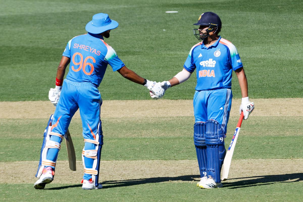 India's Shreyas Iyer (L) is congratulated by Rohit Sharma after reaching 50 runs during the second ODI.