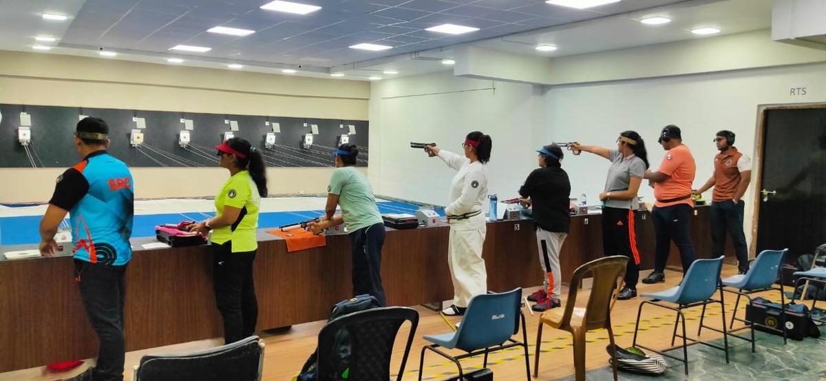 Shooters in action at the pistol shooting workshop at the Howrah Modern School shooting range in West Bengal.