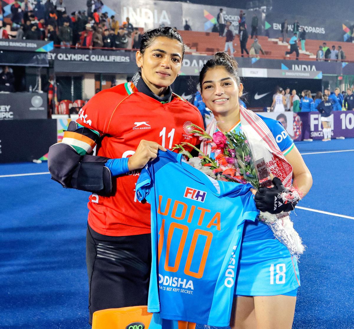 Udita (R) with a special jersey celebrating her 100th appearance for the country alongside captain Savita Punia. 