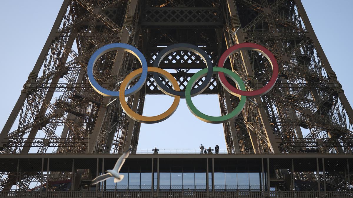 Paris Olympics organizers unveil a display of the five Olympic rings mounted on the Eiffel Tower