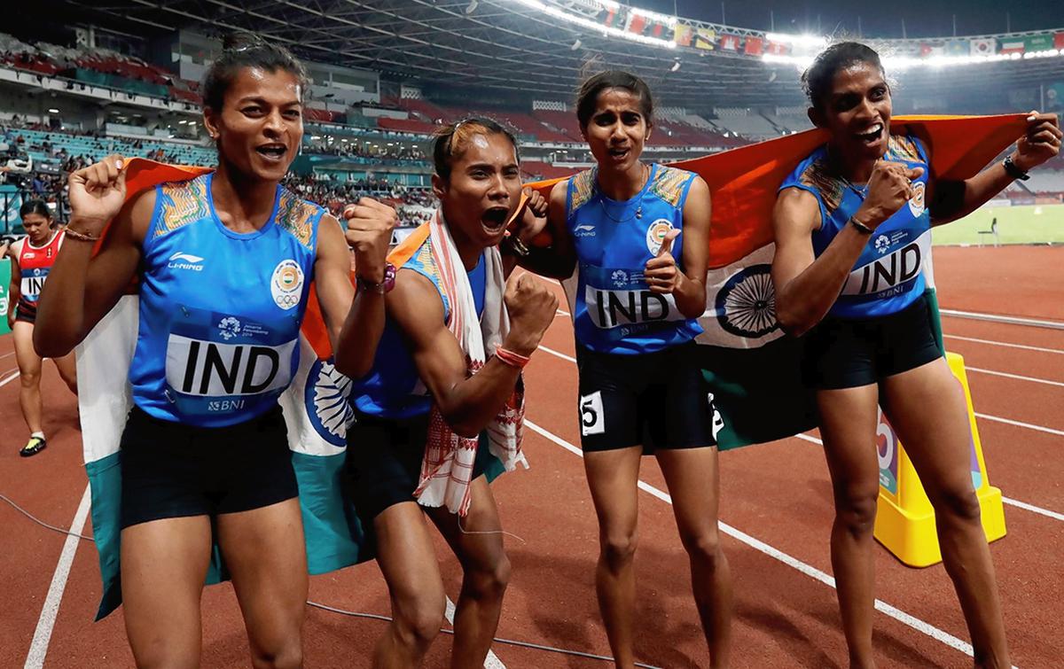 Women’s  4x400m relay team  celebrates after winning the gold medal. 