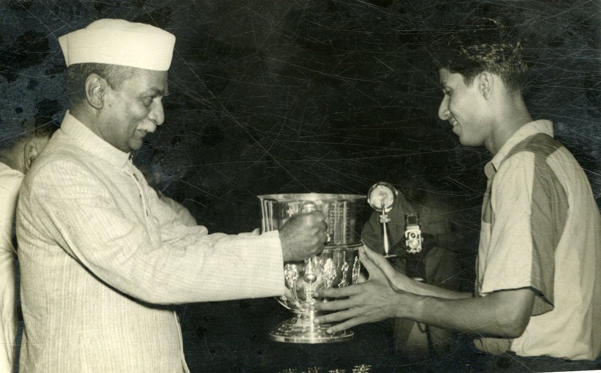 President of India Dr. Rajendra Prasad giving away the Durand Cup to B. Bose, captain of the East Bengal team in Delhi.