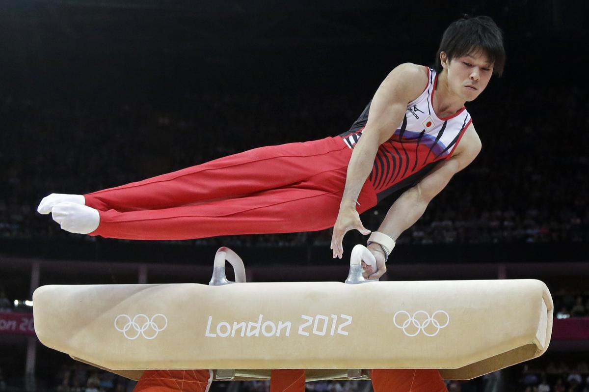 Japanese gymnast Kohei Uchimura performs on the pommel horse during the artistic gymnastics men’s individual all-around competition at the 2012 Summer Olympics.