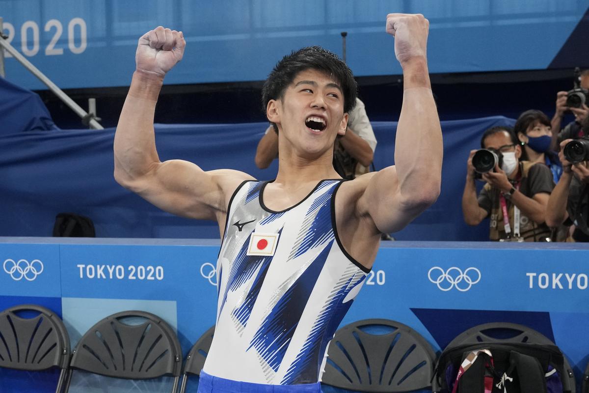 Daiki Hashimoto reacts after winning the gold medal on the horizontal bar during the artistic gymnastics men’s apparatus final at the 2020 Summer Olympics.