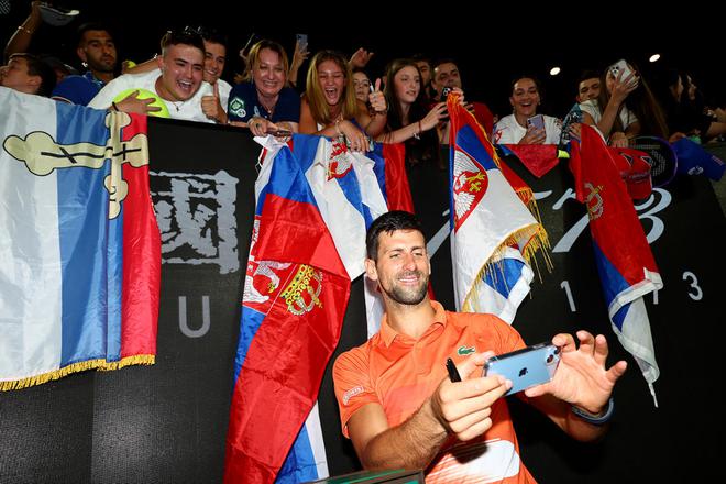 Novak Djokovic of Serbia poses for a selfie with fans after the Arena Showdown charity match against Nick Kyrgios of Australia ahead of the 2023 Australian Open at Melbourne Park on January 13, 2023 in Melbourne, Australia.