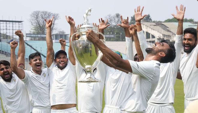 Saurashtra players celebrate after winning the Ranji Trophy 2022/23 title. 