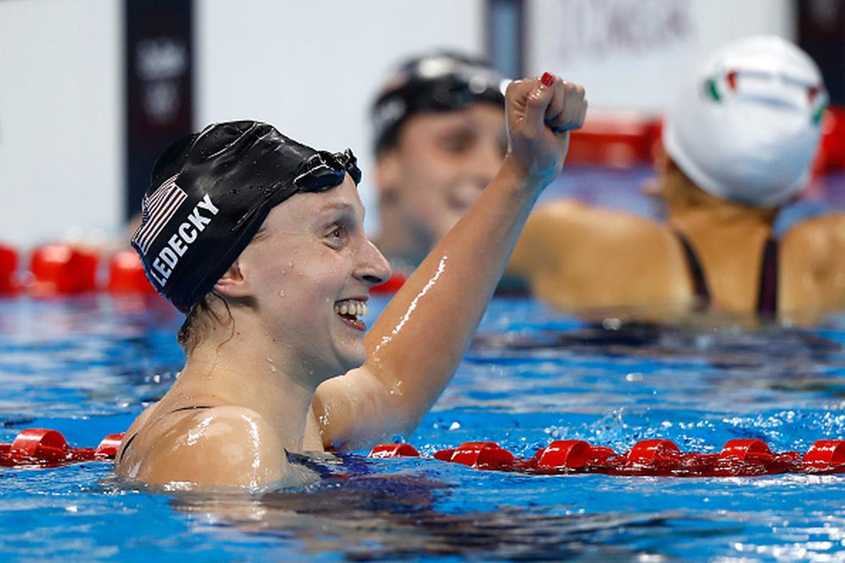 USA’s Katie Ledecky celebrates winning gold and setting a new world record in the Women’s 800m Freestyleon Day 7 of the Rio Olympic Games at the Olympic Aquatics Stadium on August 12, 2016.