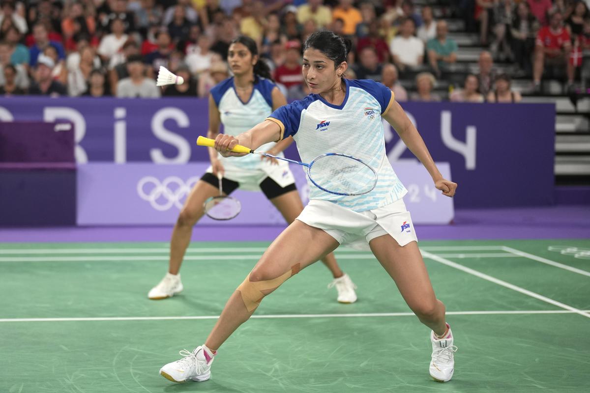 India’s Tanisha Crasto and Ashwini Ponnappa play against Australia’s Setyana Mapasa and Angela Yu during their women’s doubles badminton group stage match at Porte de la Chapelle Arena during the 2024 Summer Olympics.