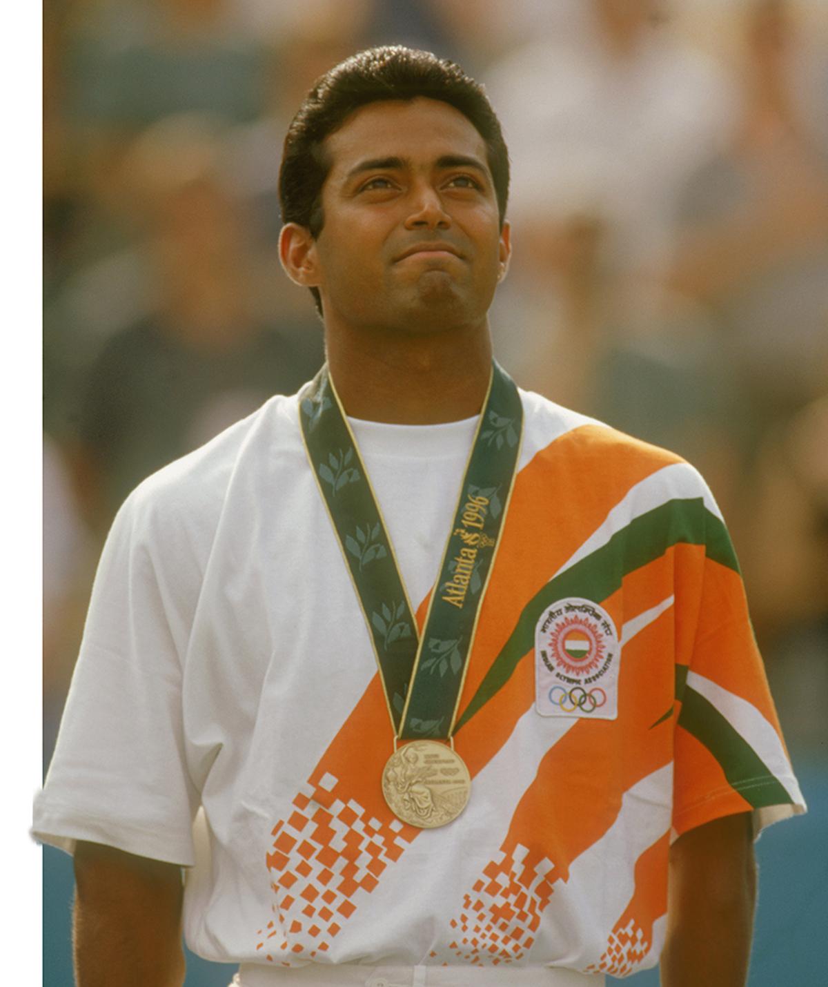 Leander Paes stands on the podium after winning a bronze medal in the men’s singles event at the 1996 Summer Olympic Games in Atlanta.