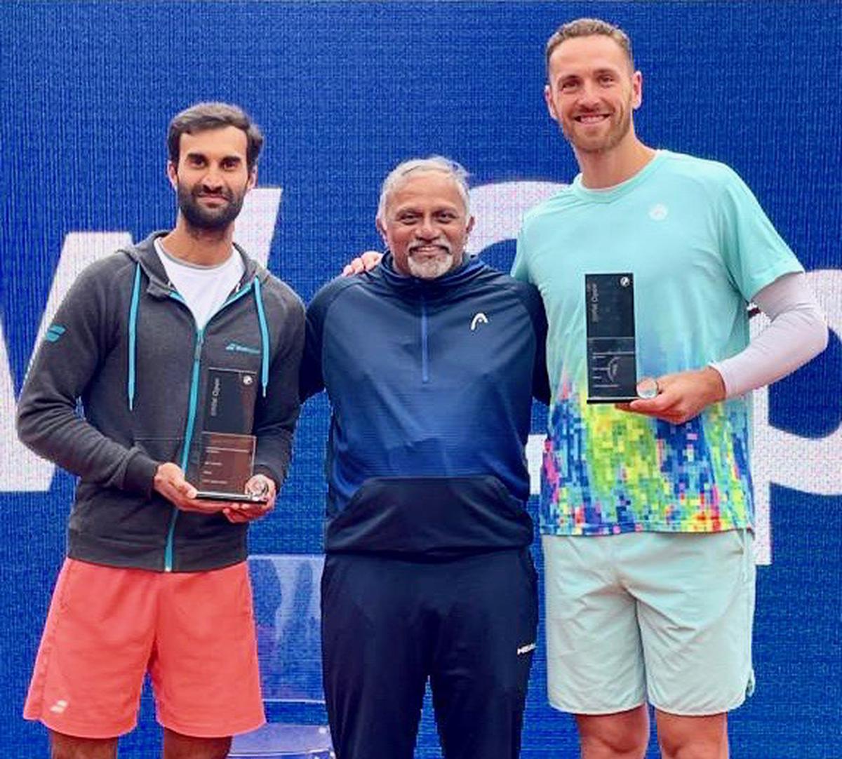 Doubles champions, Yuki Bhambri and Albano Olivetti with
coach M Balachandran in the ATP tennis tournament in Munich on Sunday.