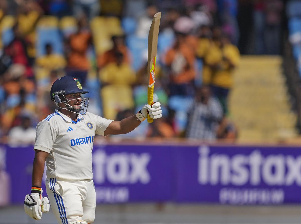 India’s Sarfaraz Khan raises his bat after scoring his half-century. It was his second in his debut Test, having scored another in the first innings.