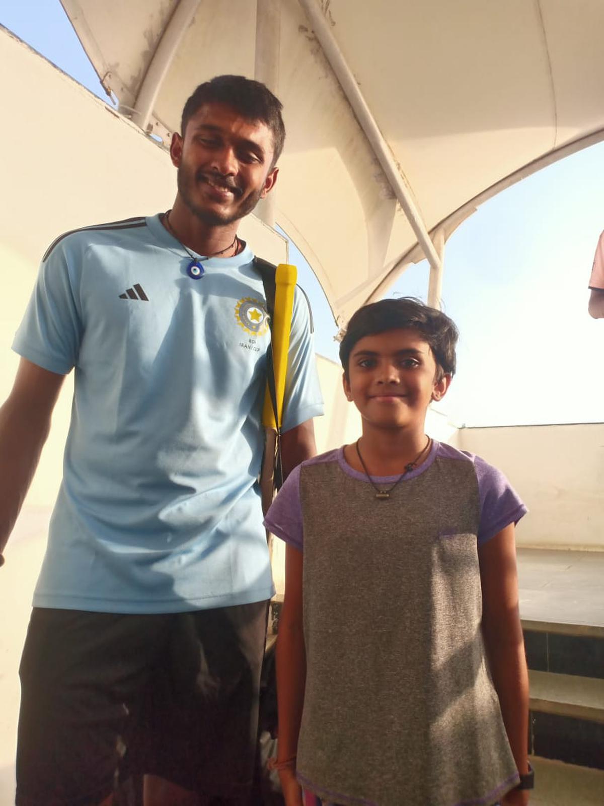 Eleven-year-old Liza Patel got clicked with Sai Sudharsan on the first day of the Irani Cup match at Rajkot on Sunday. 