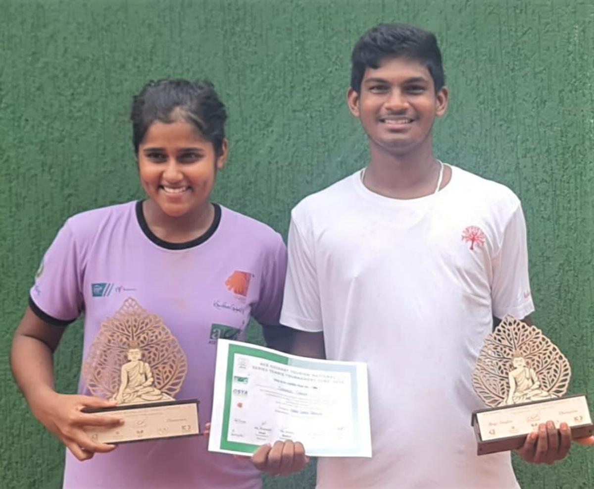 Champions Sohini Mohanty (Left) and Debasis Sahoo (right) at the National series junior tennis tournament in Ahmedabad on Saturday.