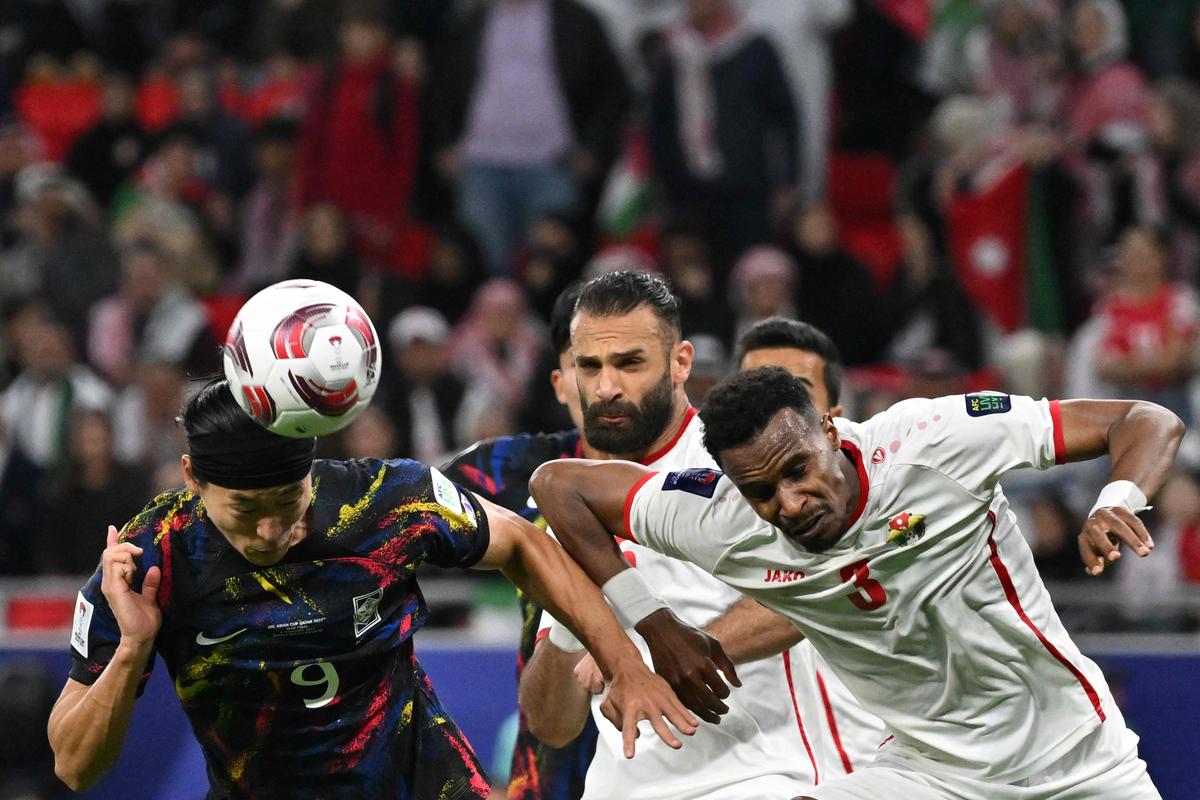 South Korea’s forward #09 Cho Gue-sung fights for the ball with Jordan’s defender #03 Abdallah Nasib during the Qatar 2023 AFC Asian Cup semi-final football match between Jordan and South Korea at the Ahmad Bin Ali Stadium in Al-Rayyan, west of Doha on February 6, 2024. 