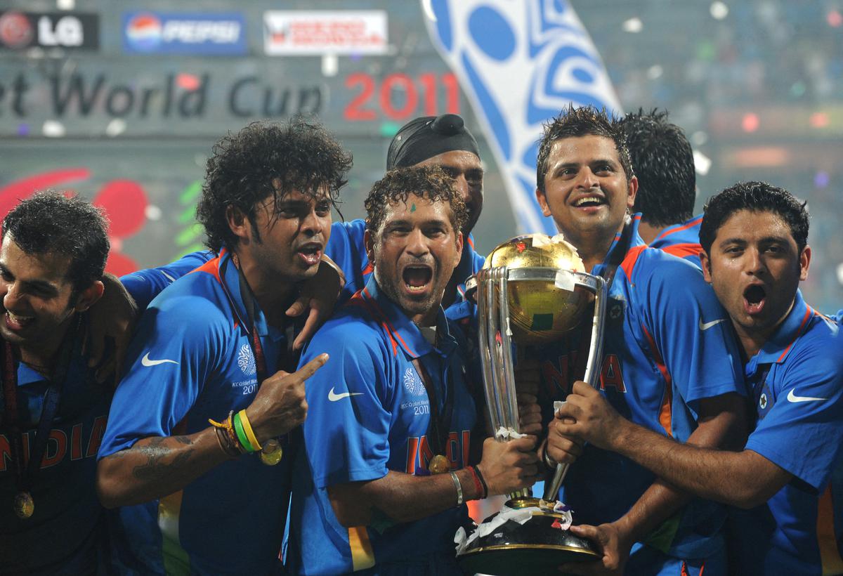 Indian cricketers (L/R): Gautam Gambhir, Shanthakumaran Sreesanth, Sachin Tendulkar, Harbhajan Singh, Suresh Raina and Piyush Chawla celebrate with the trophy after victory in the Cricket World Cup 2011 final over Sri Lanka at The Wankhede Stadium in Mumbai on April 2, 2011.