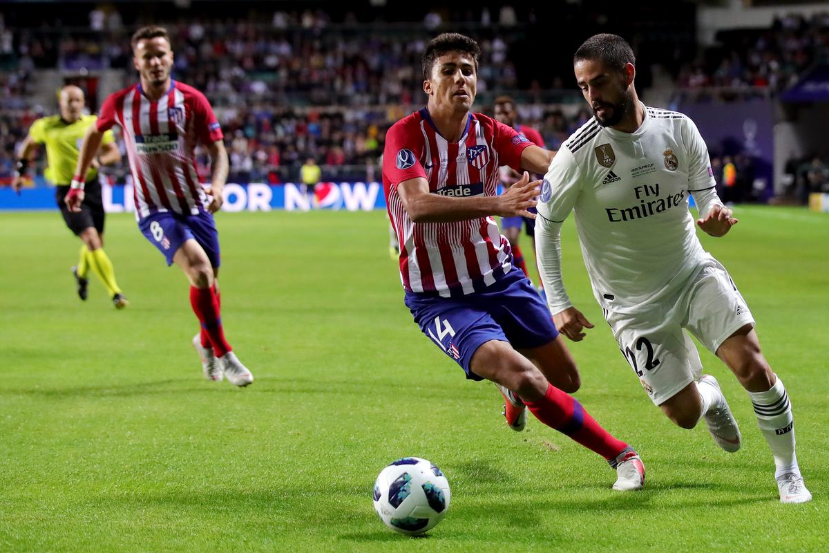 Rodri of Atletico Madrid and Isco of Real Madrid compete for the ball during the UEFA Super Cup between Real Madrid and Atletico Madrid at Lillekula Stadium on August 15, 2018 in Tallinn, Estonia.