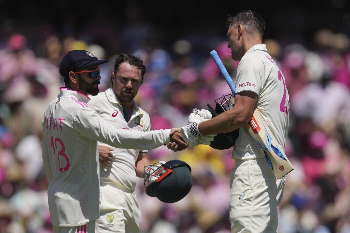 India’s Virat Kohli, left, shakes congratulates Australia’s Beau Webster, right, as Travis Head looks on following play in the fifth cricket test between India and Australia at the Sydney Cricket Ground, in Sydney, Australia, Sunday, Jan. 5, 2025.