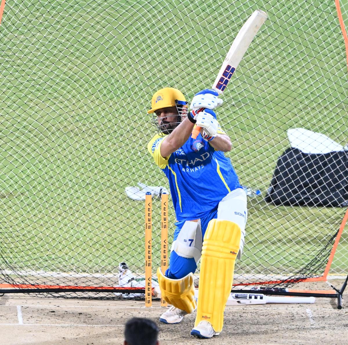 An injured MS Dhoni is seen batting during a practice session in Chennai.